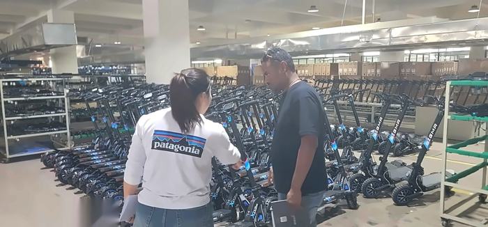 Reviewing finished electric scooters on the floor